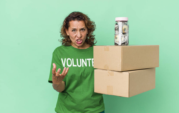middle age woman looking angry, annoyed and frustrated. volunteer and donation concept - Fotoğraf, Görsel