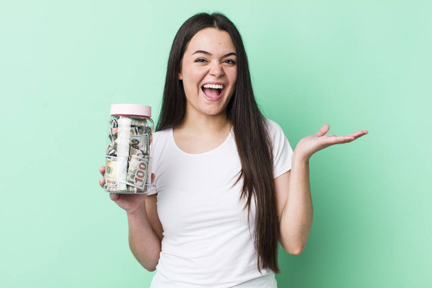 young adult woman feeling happy, surprised realizing a solution or idea. savings concept - Photo, Image