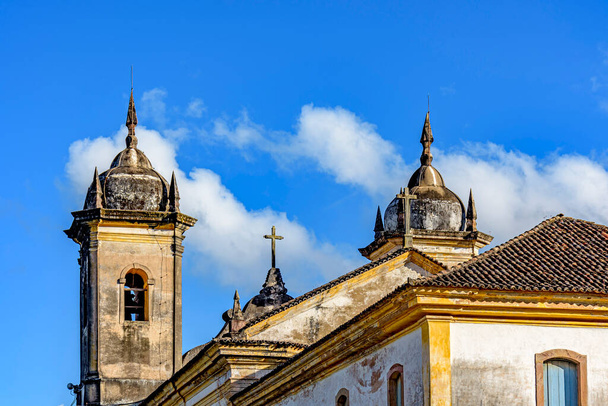 Beautiful historic church in baroque style with its towers jutting out against the blue sky in Ouro Preto, Minas Gerais - Photo, Image
