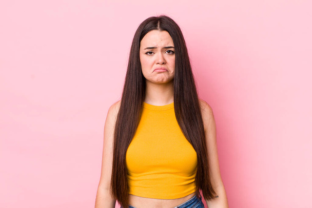 young adult woman feeling sad and whiney with an unhappy look, crying with a negative and frustrated attitude - Foto, immagini