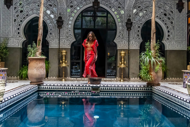 A gorgeous model poses inside a home environment in Medina, Morocco, Africa - Photo, Image
