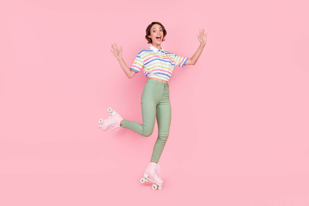 Full body photo of young girl happy positive smile sportive rider street isolated over pink color background. - Valokuva, kuva