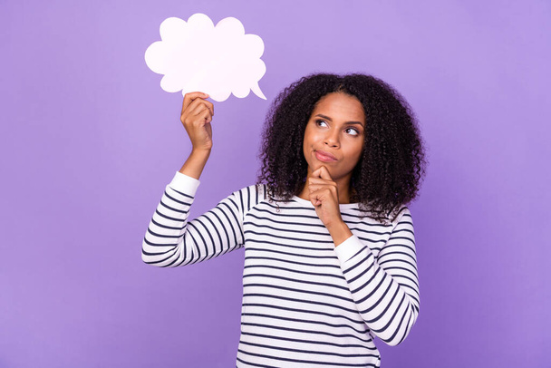 Photo of thoughtful minded, young lady hold speech bubble brainstorming isolated on violet color background. - Photo, image