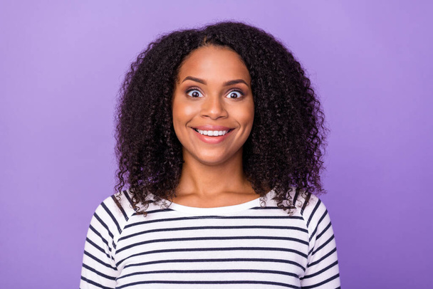 Portrait of young smiling amazed crazy lady staring see huge sale discount isolated on purple color background. - Foto, imagen