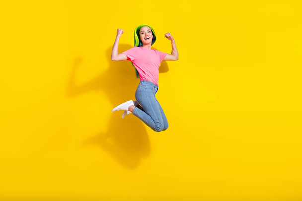 Full length body size view of attractive cheerful lucky girl having fun jumping rejoicing isolated over bright color background. - Fotó, kép
