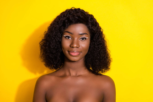 Photo of young charming lovely african girl wear no clothes morning bathroom routine isolated on yellow color background. - Zdjęcie, obraz