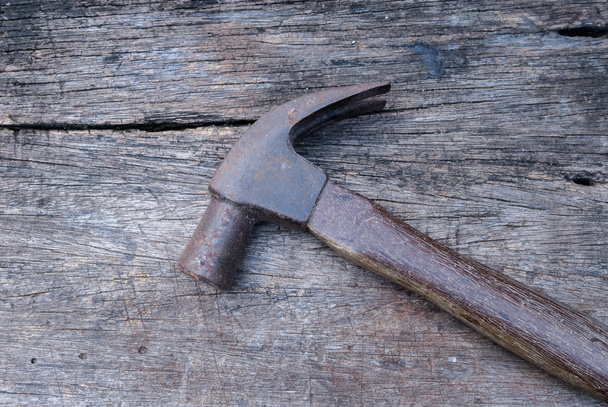 Old vintage hammer hand tools on wood background - Foto, Bild