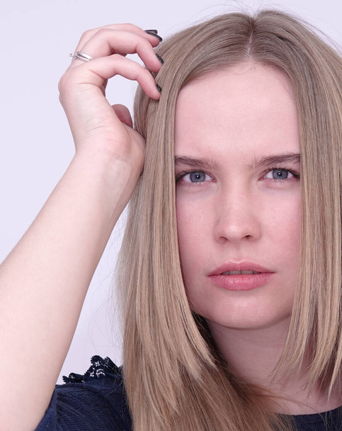 Portrait of a model blue-eyed blonde girl without makeup - Fotó, kép