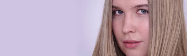 Portrait of a model blue-eyed blonde girl without makeup - Photo, Image