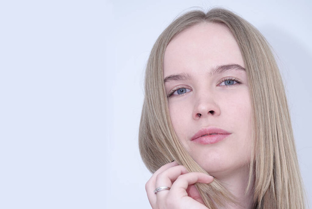 Portrait of a model blue-eyed blonde girl without makeup - Zdjęcie, obraz