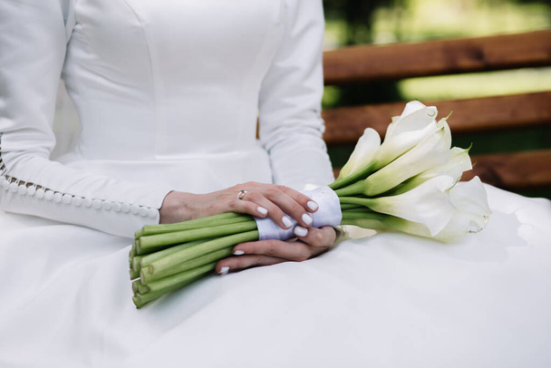Bride holding big wedding bouquet on wedding ceremony - Photo, Image