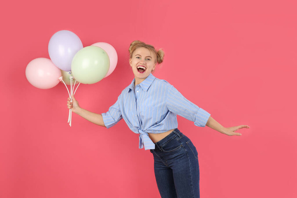 Concept of Happy Birthday with attractive girl on pink background - Foto, afbeelding