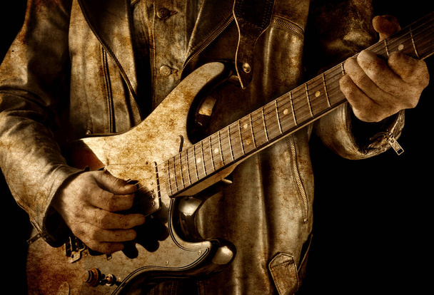 brudny obraz muzyka rockowego gra na gitarze elektrycznej - Zdjęcie, obraz