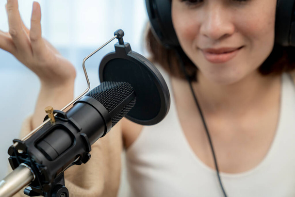 Asian female radio host are streaming talk about audio podcast online at home - Zdjęcie, obraz