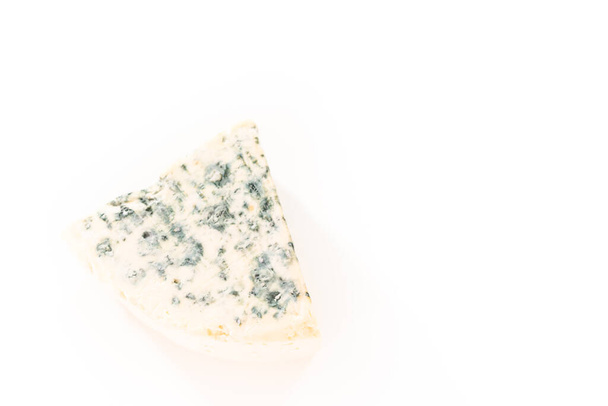 Large slice of blue cheese on a white background. - Foto, imagen