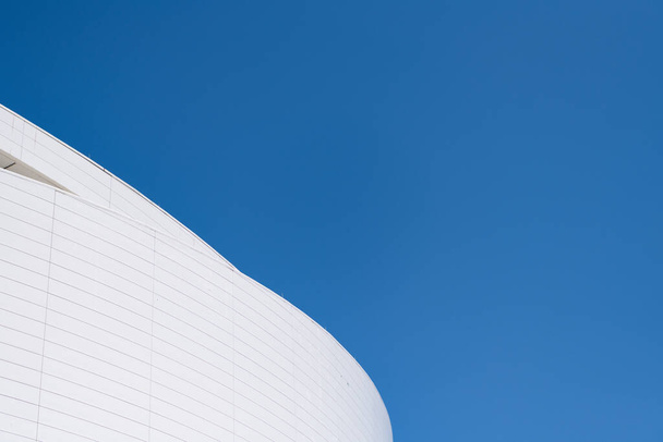 Architectural detail of modern building facade exterior architecture on blue sky, copy space. - 写真・画像
