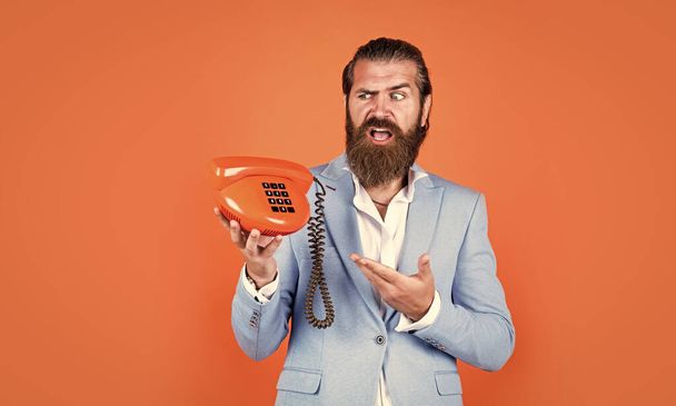handsome caucasian businessman with trendy hairstyle in jacket speak on vintage phone, call. - Foto, Bild