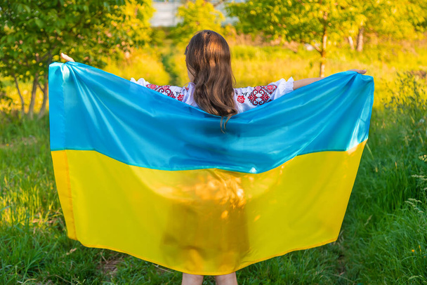 Child with Ukrainian flag patriot stop war. Selective focus. Kid. - Φωτογραφία, εικόνα