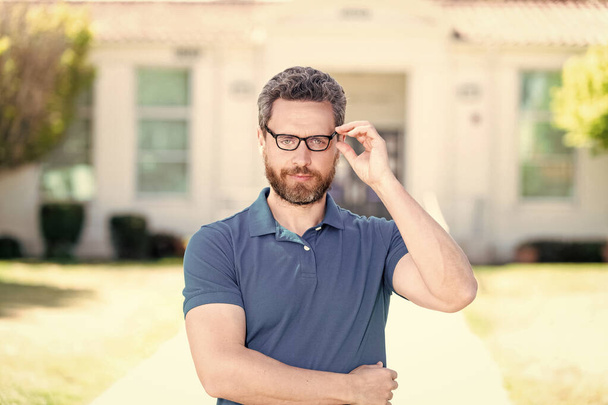 eyesight. vision correction. eye health. optical eyecare. back to school. knowledge and education. mature teacher nerd looking smart. smiling bearded man look through eyeglasses. vision acuity. - Photo, Image