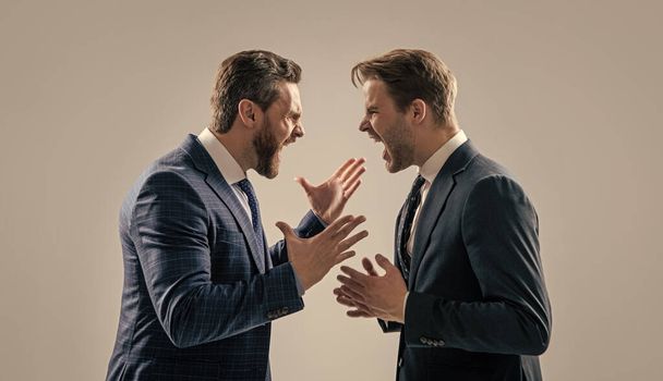 dissatisfied men discuss failure. two colleagues have disagreement and conflict. businessmen face to face. disrespect and contradiction. business partners blame each other. arguing businesspeople. - Photo, Image