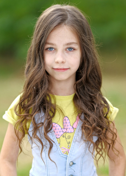 portrait of little girl outdoors in summer - Фото, изображение