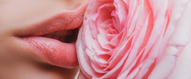 Lips with lipstick closeup. Beautiful woman lips with rose. Oral sex - Foto, immagini