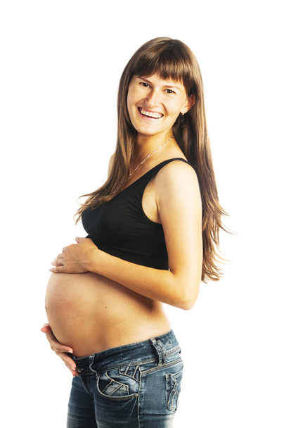 Pregnant woman holding her belly - Valokuva, kuva