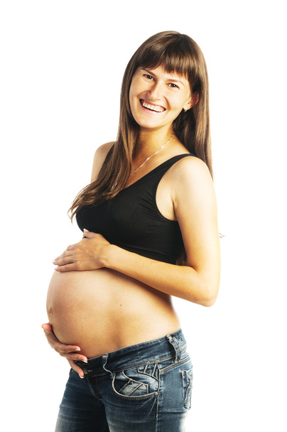 Pregnant woman holding her belly - Foto, afbeelding