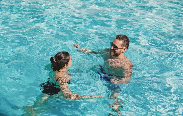 Summer pool resort. Life winner. Couple in pool. Pool party - Fotografie, Obrázek
