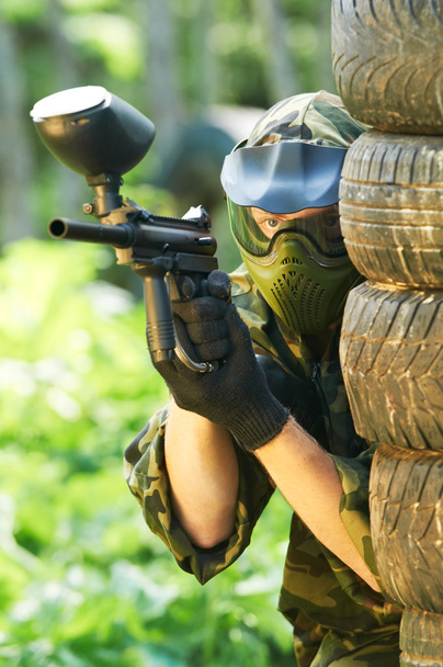 Paintball player under cover - Photo, Image