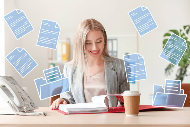 Businesswoman with digital files in office - Photo, Image