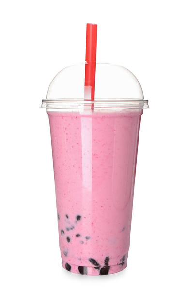 Plastic cup of tasty bubble tea on white background - Foto, Imagen