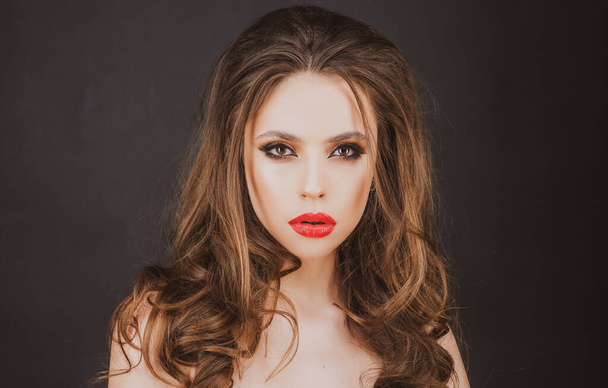 Closeup beauty portrait. Red lips makeup. Young woman with bright make-up. Red lipstick lipgloss - Foto, afbeelding