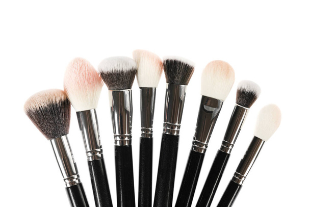 Professional makeup brush made of natural pile on a white background - Foto, imagen