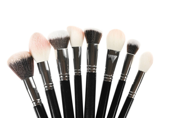 Professional makeup brush made of natural pile on a white background - Фото, изображение