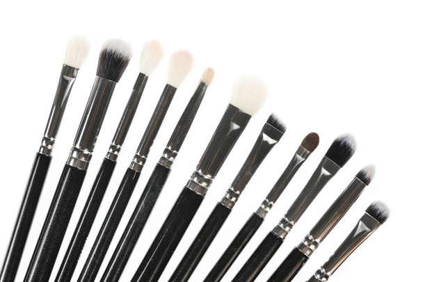 Professional makeup brush made of natural pile on a white background - Фото, изображение