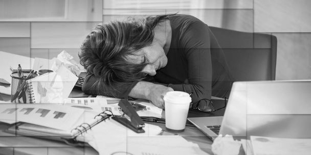 Overworked mature businesswoman sitting at a messy desk, geometric pattern - Fotoğraf, Görsel