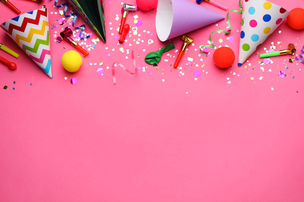 Beautiful flat lay composition with festive items on pink background, space for text. Surprise party concept - 写真・画像