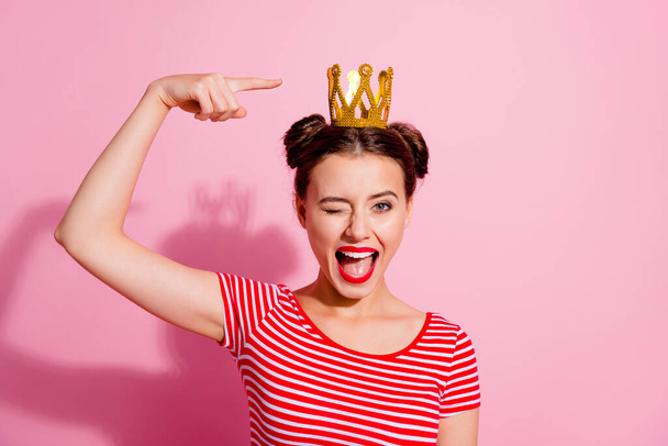 Photo of funky positive person indicate finger golden crown isolated on pink color background. - Φωτογραφία, εικόνα