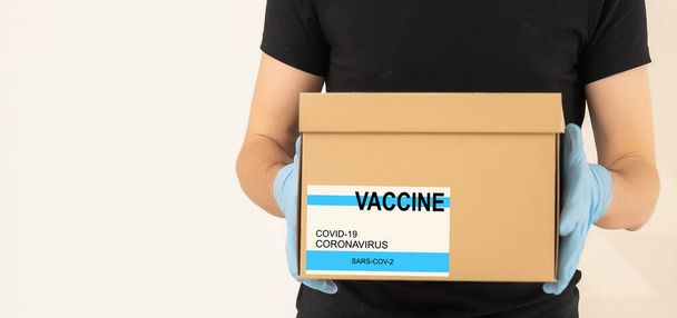 Close-up de caixas de papel com vacina coronavírus, espaço de cópia, pandemia mundial, covid-19, quarentena, panorama - Foto, Imagem