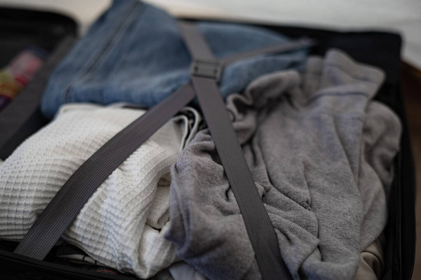 Clothes that are packed in luggage - Photo, Image