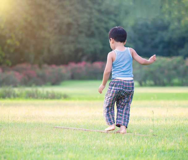 An asian boy playing outdoor activity with excited on something new, learning via outdoor activity, child will going to large world to grow up in the future - Φωτογραφία, εικόνα