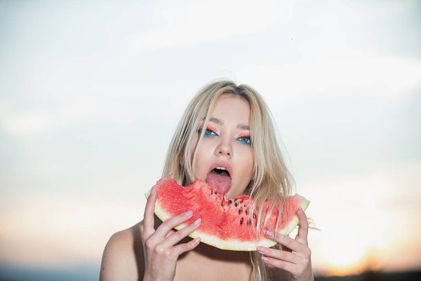 Portrait of a happy young woman with watermelon. Youth lifestyle. Happiness summer holiday. Sexy mouth bite watermelons - Foto, Imagem