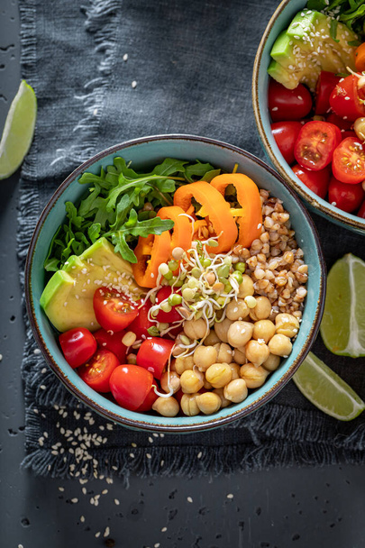 Healthy salad with chickpeas, vegetables and buckwheat groats. Healthy bowls for fit people. - Fotografie, Obrázek
