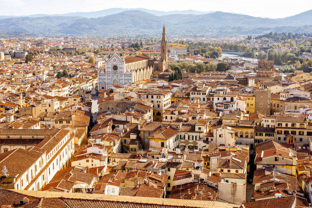 Aerial cityscape of Florence city on a sunny day. Visiting italian cities in Tuscany. View from Vecchio palace - Photo, image