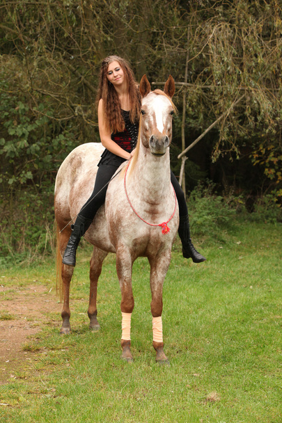 Pretty girl riding a horse without any equipment - Photo, Image