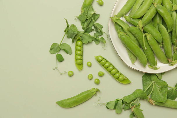 Freshly harvested organic green peas on the table - Photo, image