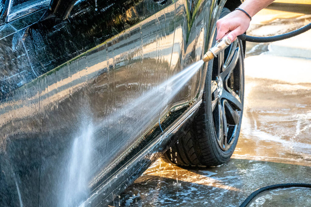 auto detailer washing luxury high end car - Photo, Image