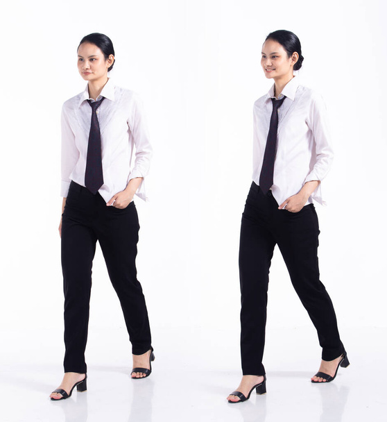 Full length 20s young Mix Race Woman  bartender worker employee, walking forward left right, wear formal necktie and shirt. Office female stands feels stress over white background isolated - Foto, Imagen