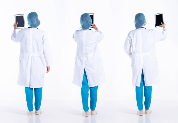 Full length 20s young Mix Race hospital Doctor Woman, working hard on patient chart, wear mask stethoscope coat uniform. Surgeon female feels happy smile over white background isolated - Photo, Image